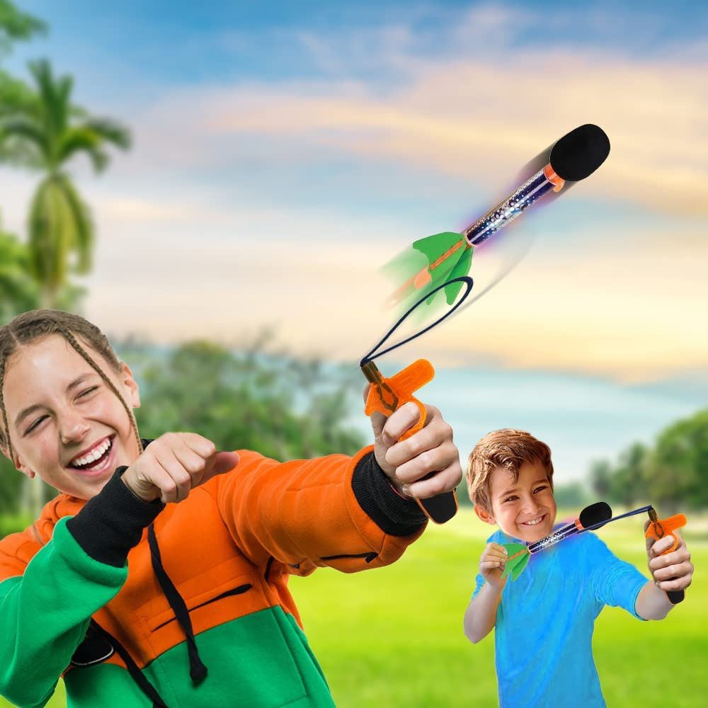 ArtCreativity Light Up Sky Missiles for Kids, Set of 2, Flying Toys for Kids with Rubber Launcher, Lights and Whistling Sounds, Camping, Lawn and Backyard Toys, Outdoor Games for Boys and Girls